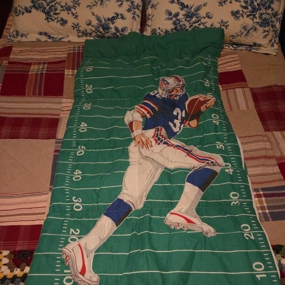 football player graphic on a green field with yard lines